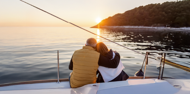 couple sitting on their boat enjoying the sunset
